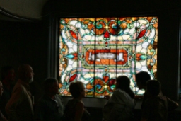 A tour group admires one of the many windows